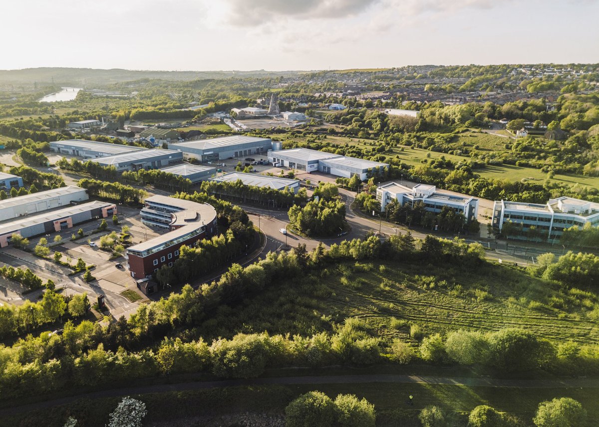 Aerial view of a business park with multiple office buildings across multiple sites
